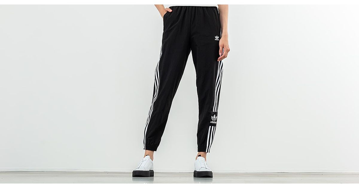 adidas originals adicolor locked up logo track pants in black