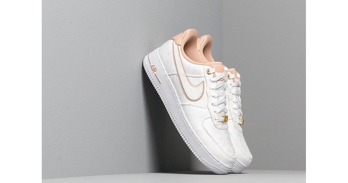 Nike Air Force 1 '07 sneakers in white and gold metallic