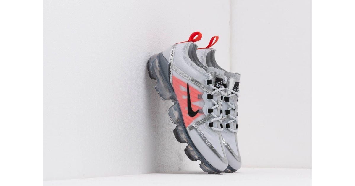 black white and orange vapormax