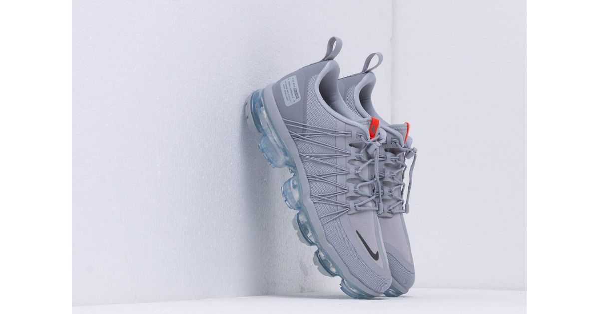 gray and orange vapormax