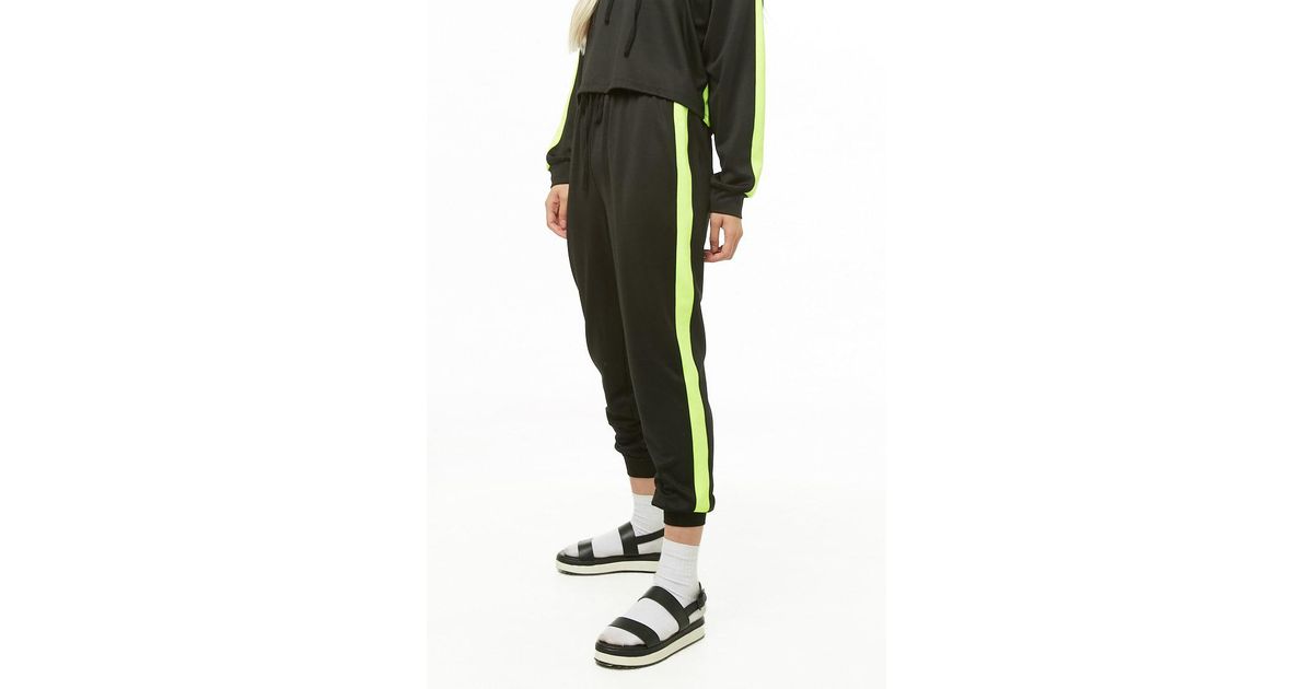 yellow joggers black stripe