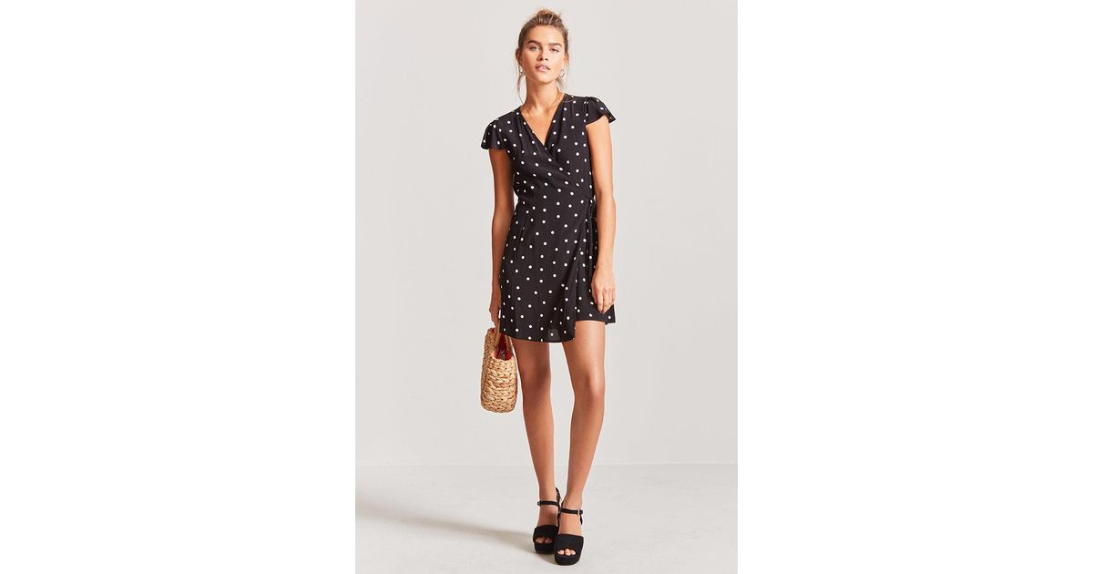 white and black polka dot wrap dress