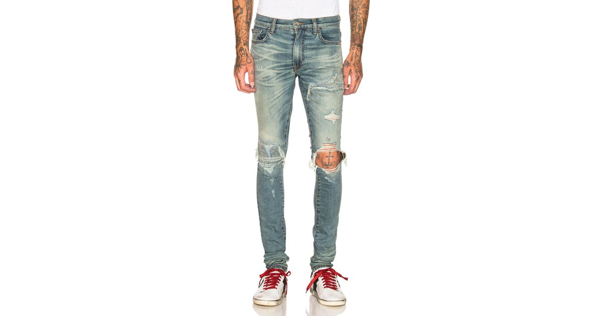 Amiri Mx1 Denim Patch Broken Jean in 