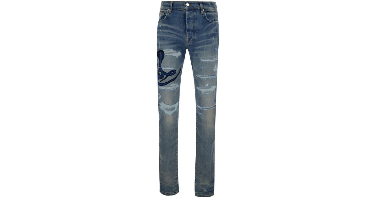Jeans Skinny Con Strappi E Patch Serpente da Uomo di Amiri in Blu