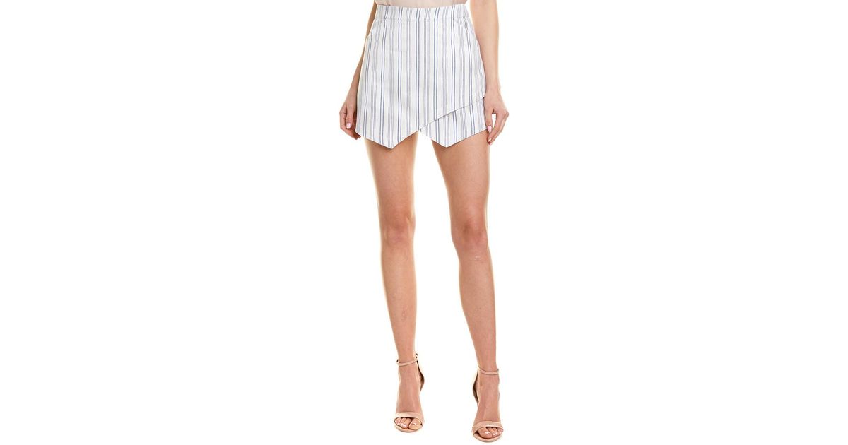 white asymmetrical mini skirt