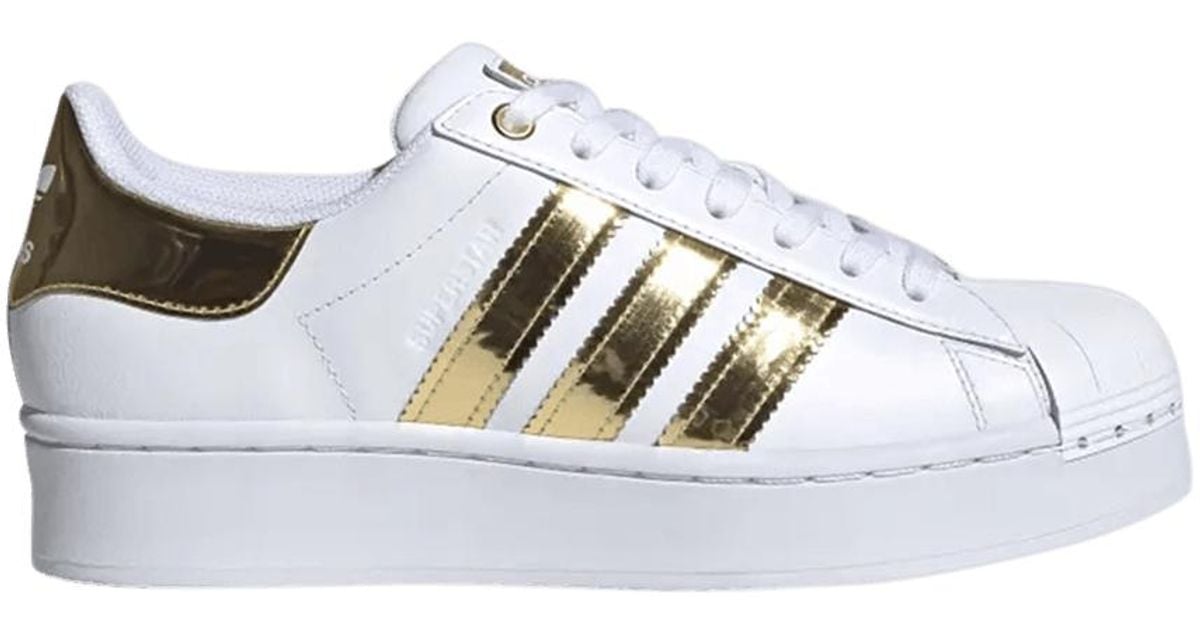 white adidas superstar gold