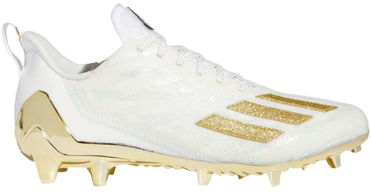 white and gold adidas cleats