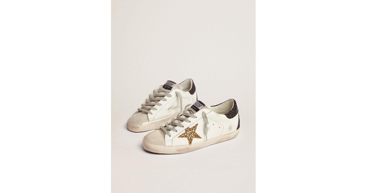 superstar sneakers with gold star and glittery black heel tab