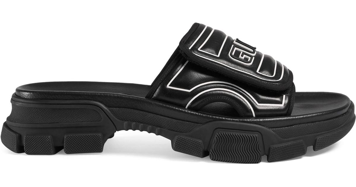 Gucci Logo-embossed Leather And Rubber Slides in Black for Men - Lyst