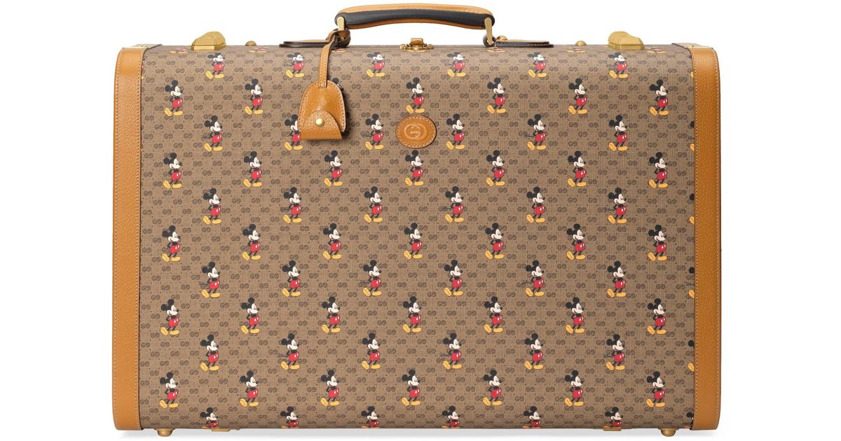 gucci on X: Luggage and accessories from the #DisneyXGucci collection to  celebrate the Year of the Mouse, crafted in GG motif printed with Mickey  Mouse and trimmed in leather. ©Disney  /
