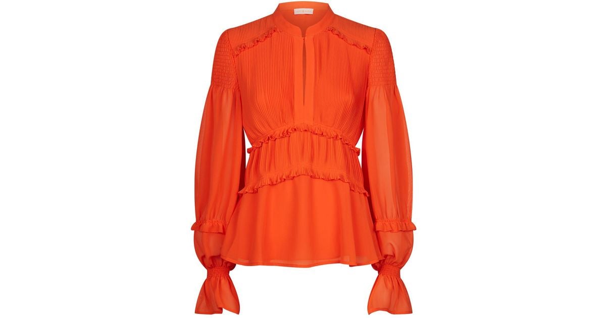 orange ruffle blouse