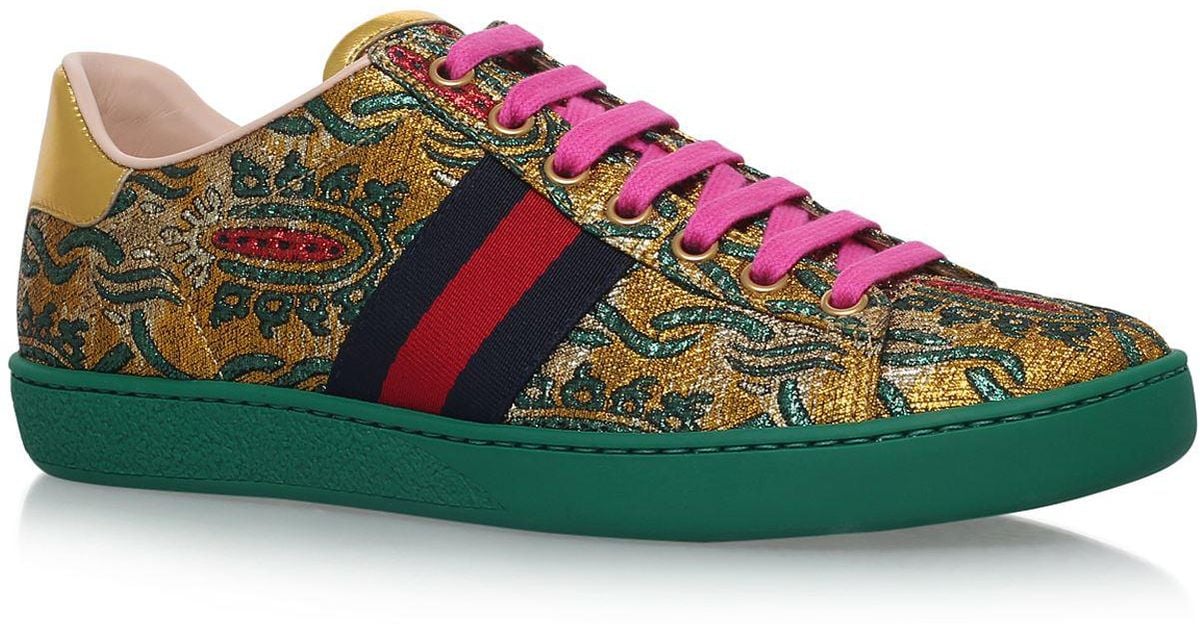 gold gucci trainers