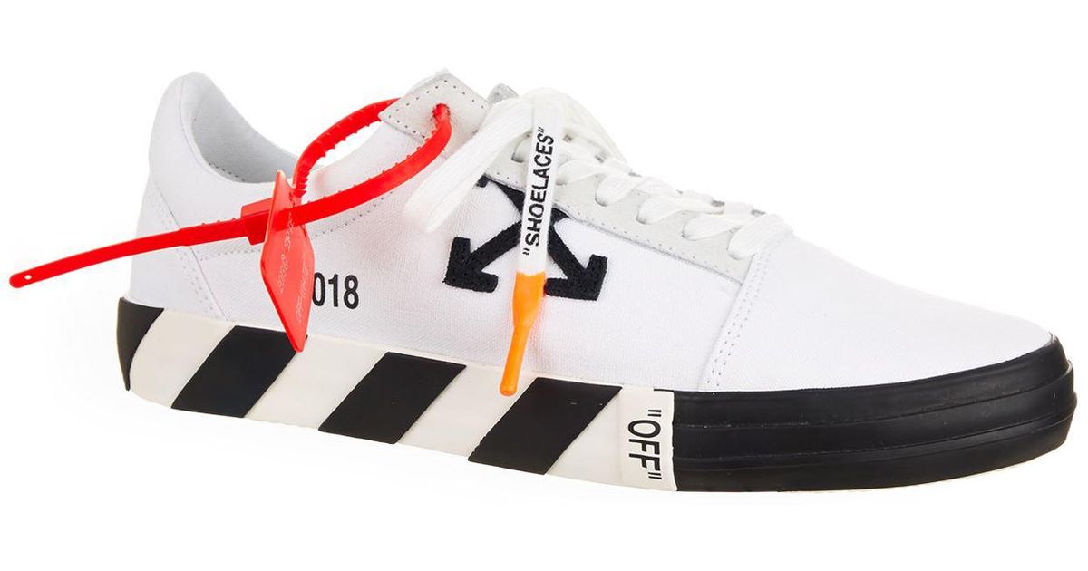 off white canvas low top sneakers