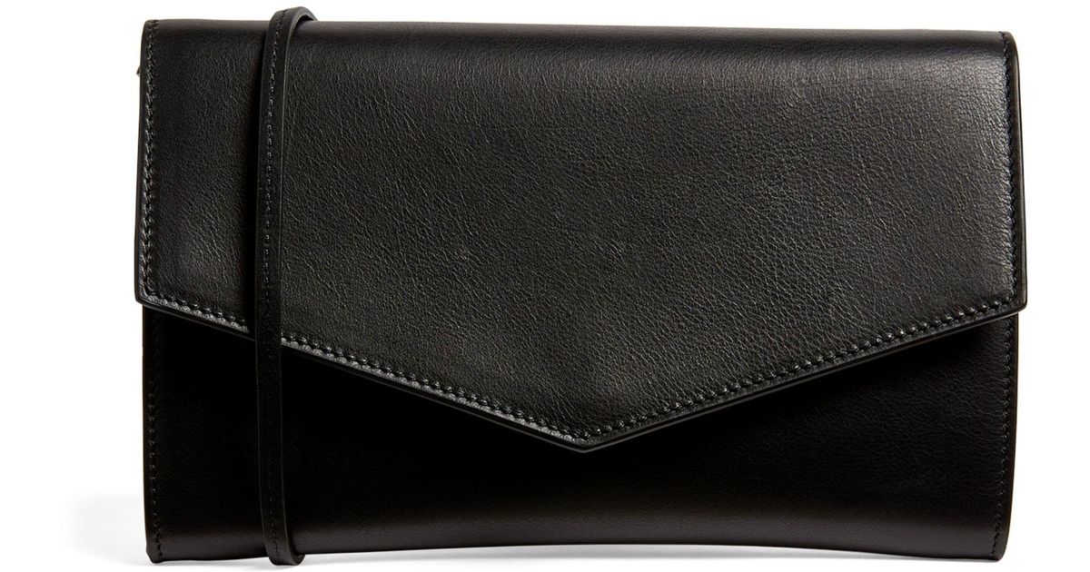 The Row Leather Envelope Crossbody Bag in Black Lyst