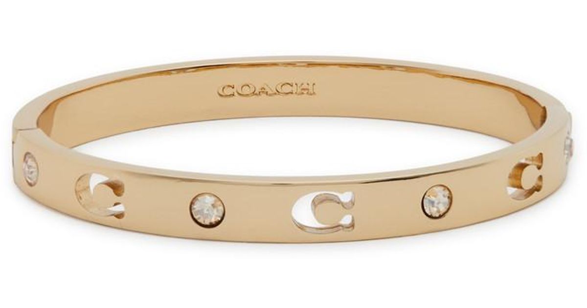 Elegant Coach Silver Bangle with Gold Daisy Accents