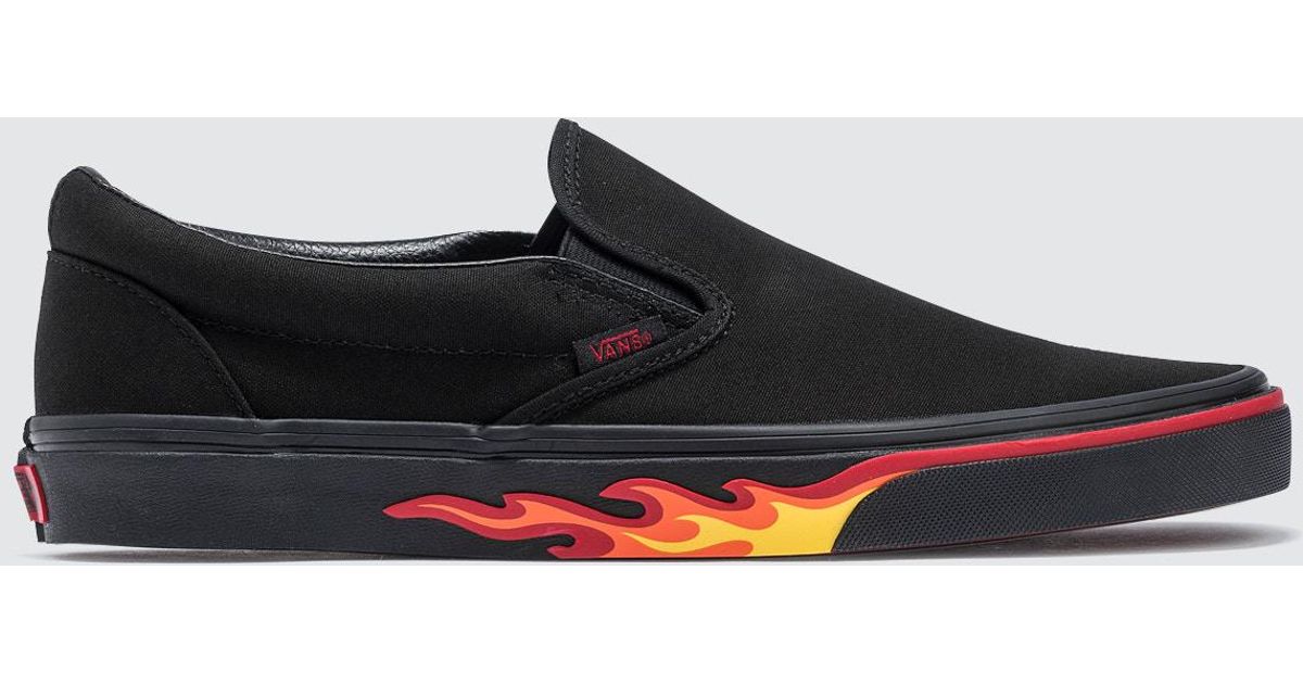 black slip on vans with flames