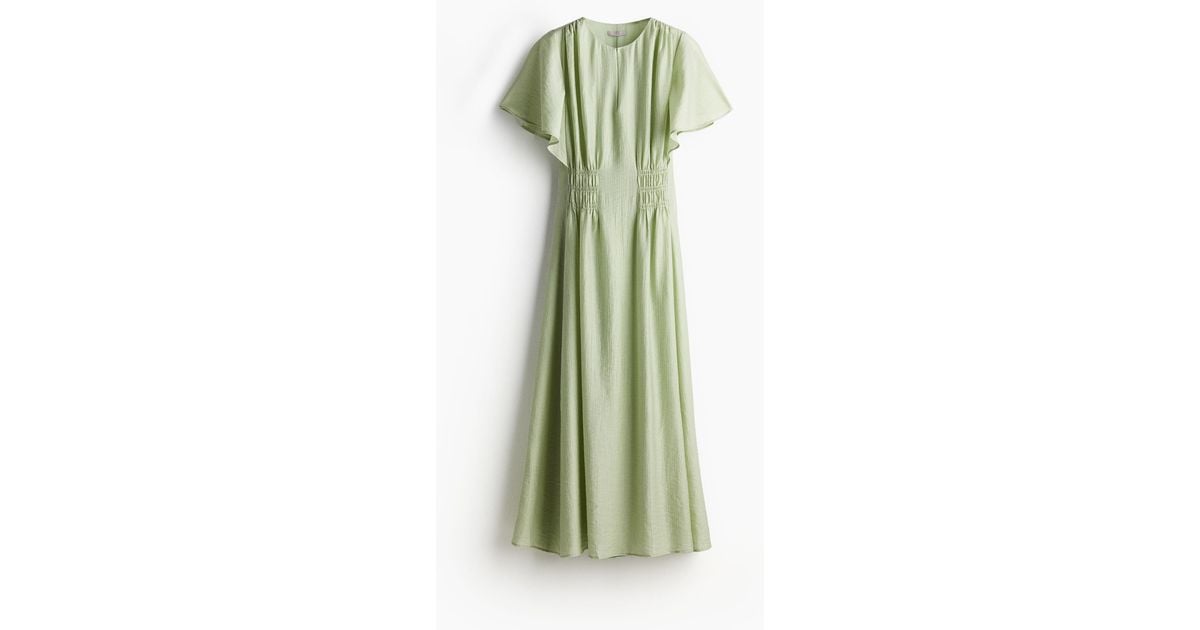Robe longue a taille smockee H M en coloris Vert Lyst