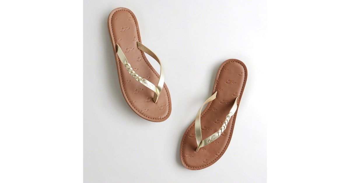 gold leather flip flops