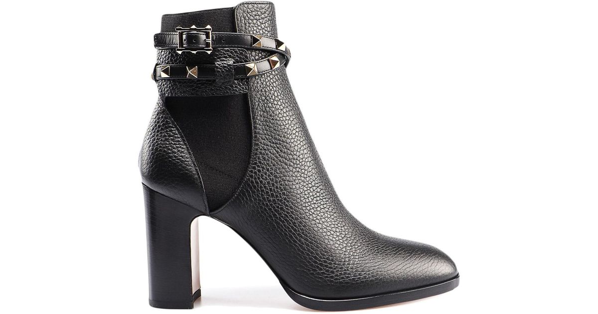 black studded strap ankle boots