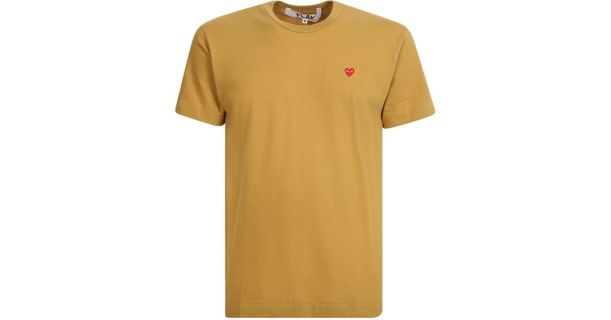 orange comme des garçons shirt