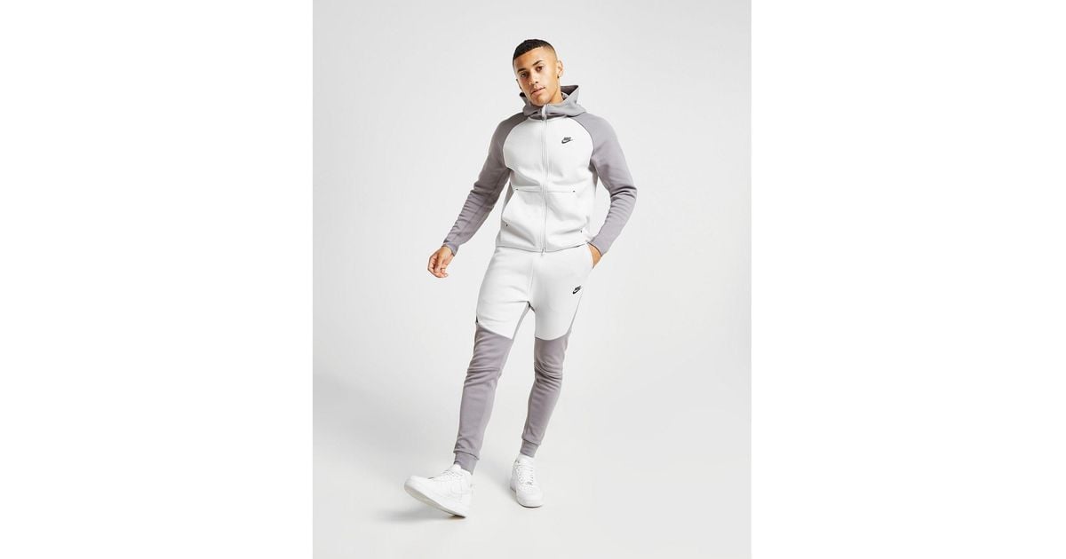 nike tech tracksuit grey and white