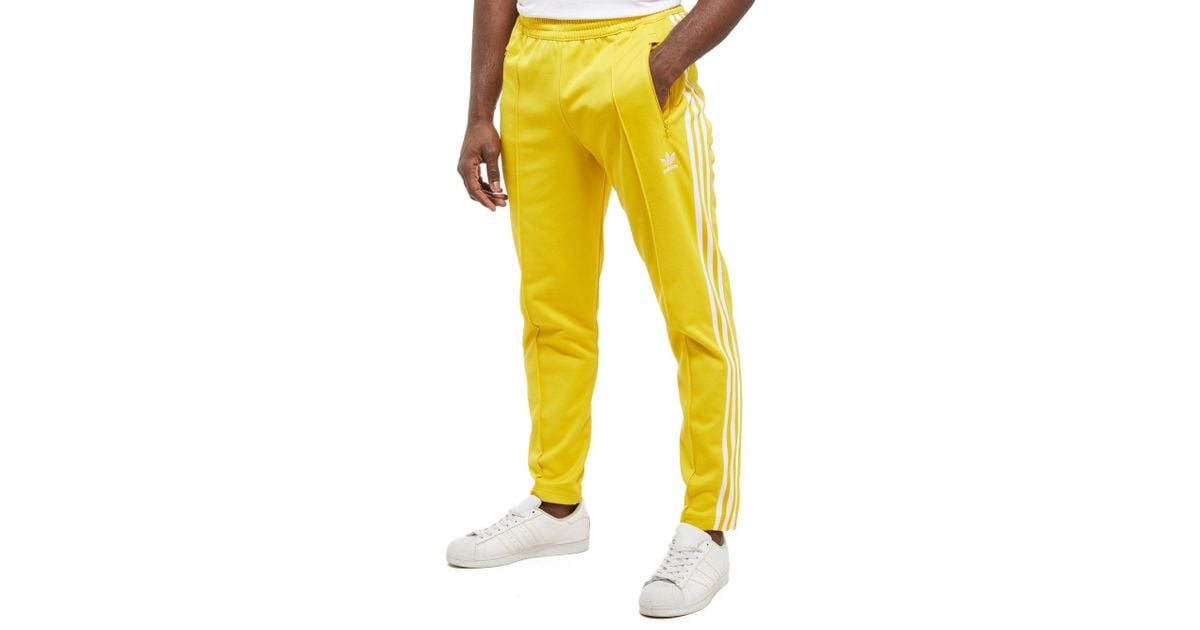 yellow track pants adidas
