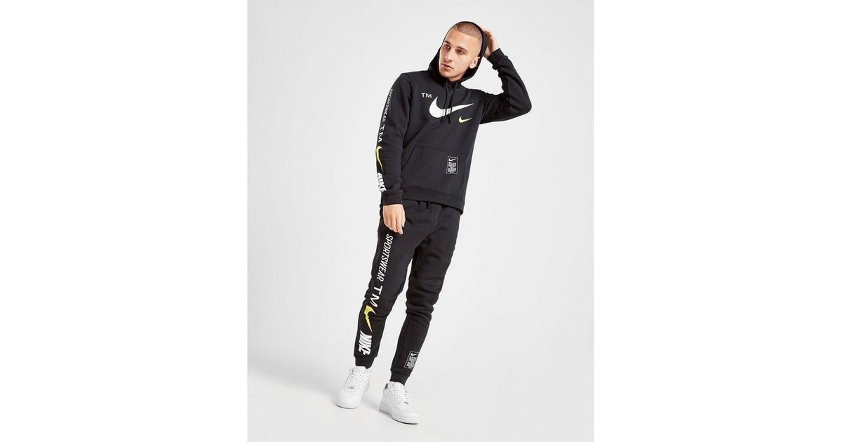 nike overbranded cuffed joggers in black