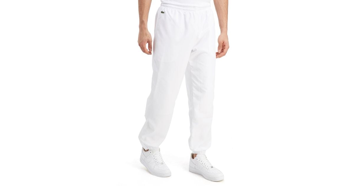 grey lacoste guppy track pants