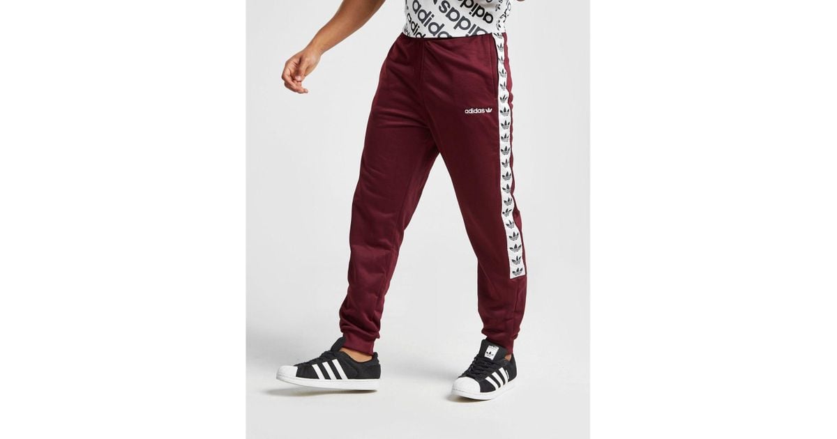 adidas taped poly track pants