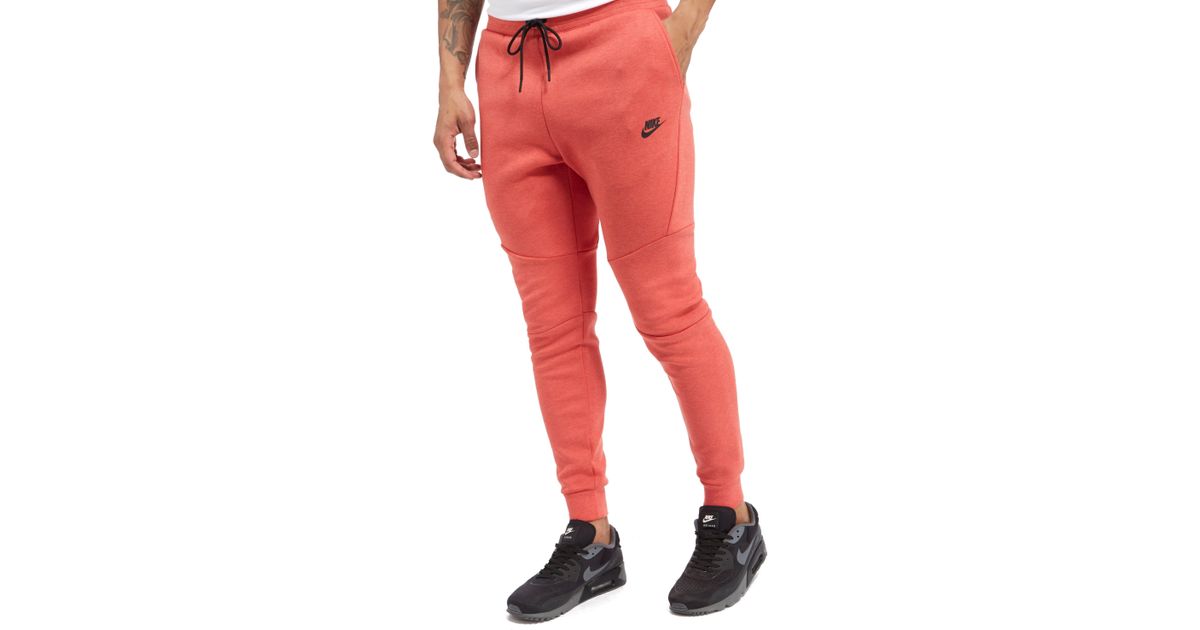 red nike tech pants