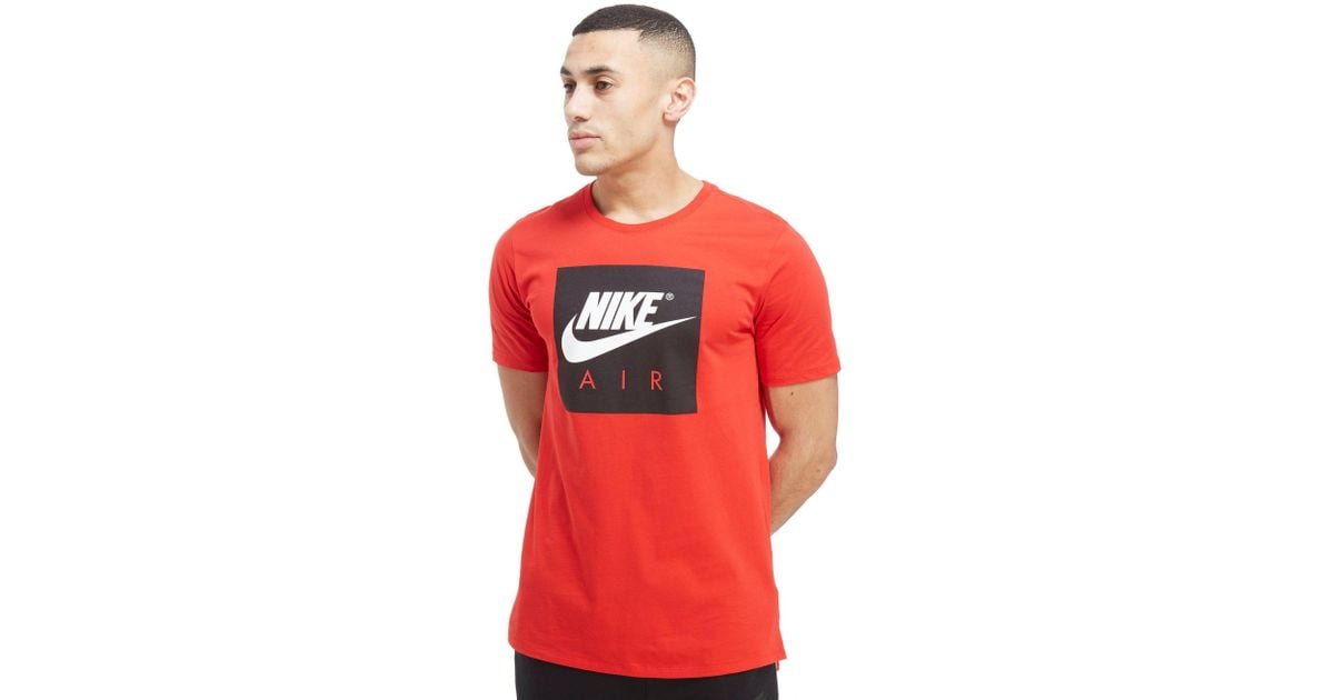 black nike shirt with red logo