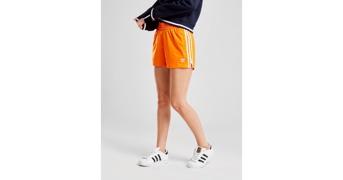 adidas shorts orange stripes