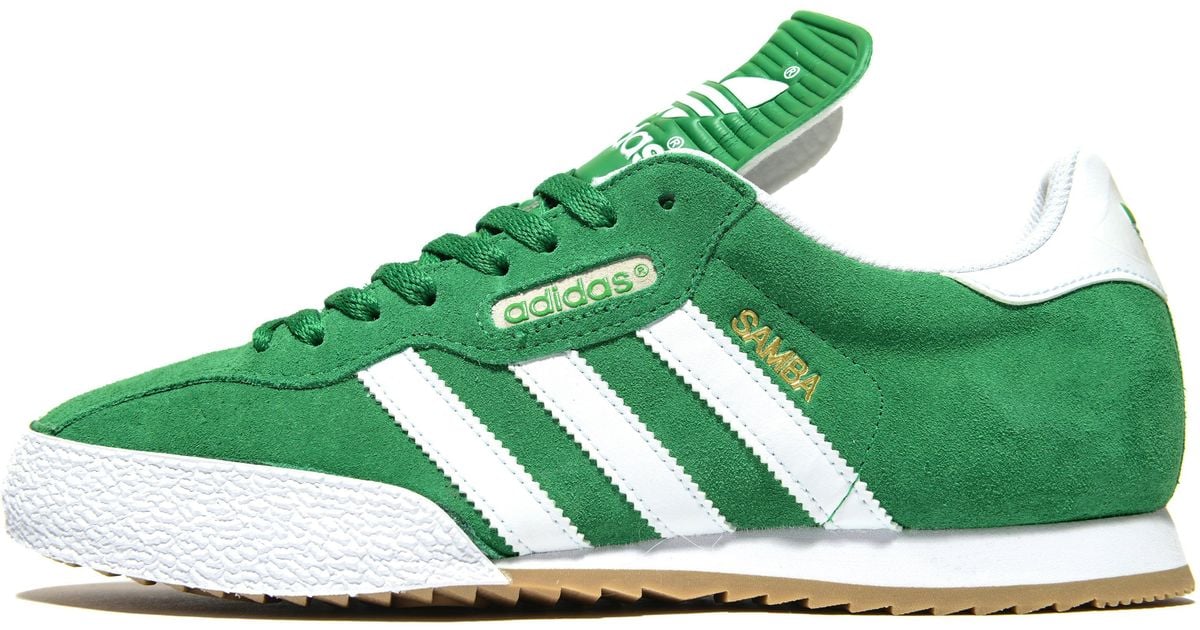 white and green adidas samba