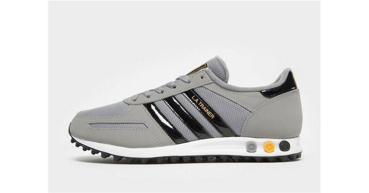 adidas la trainer black gold