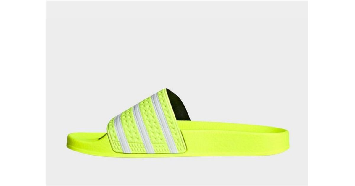 adilette slides solar yellow