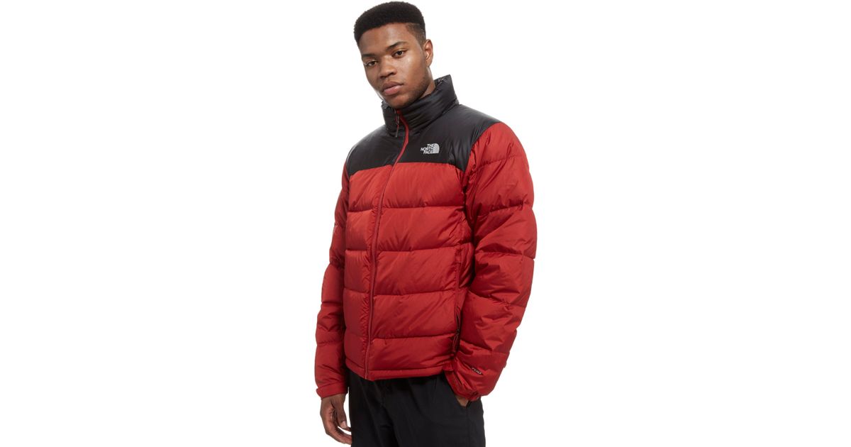 red and black north face nuptse jacket