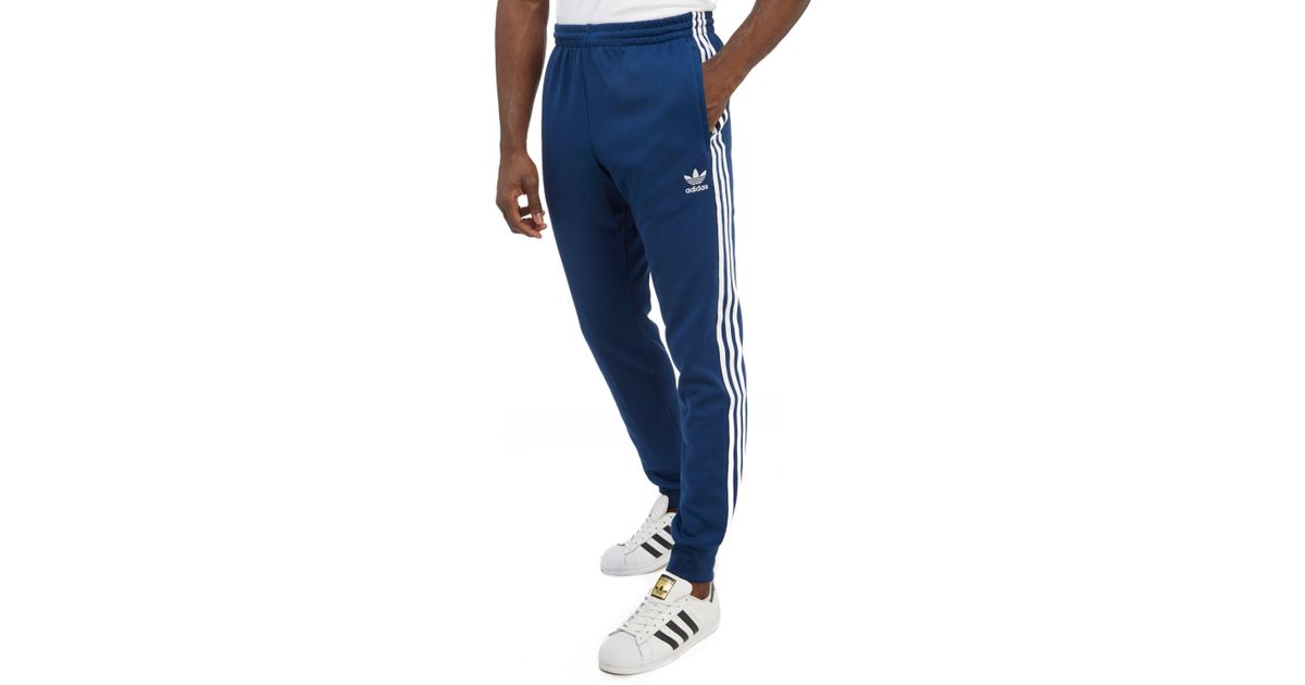 adidas originals three stripe track pant in blue