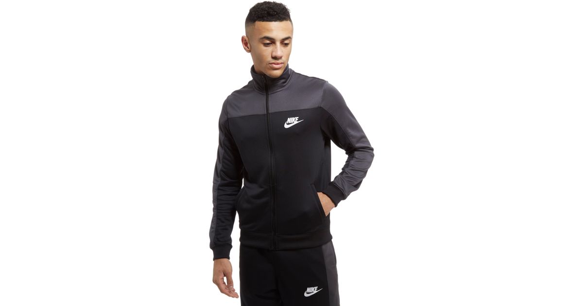 black and grey tracksuit nike