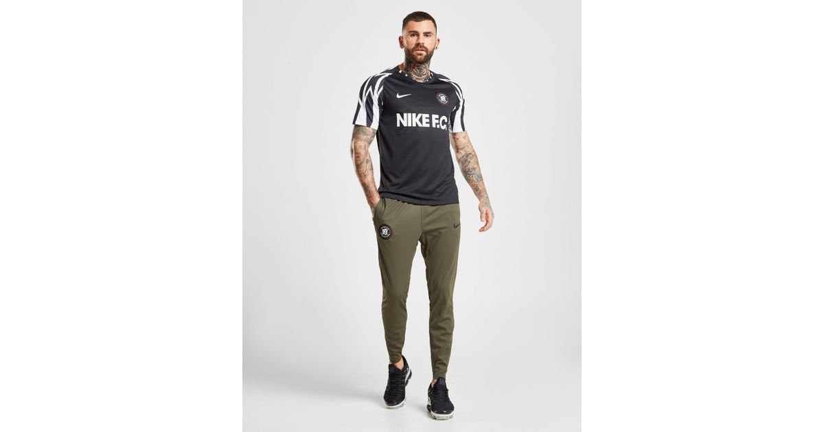 nike fc tape track pants