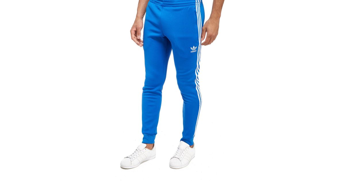 blue striped adidas pants