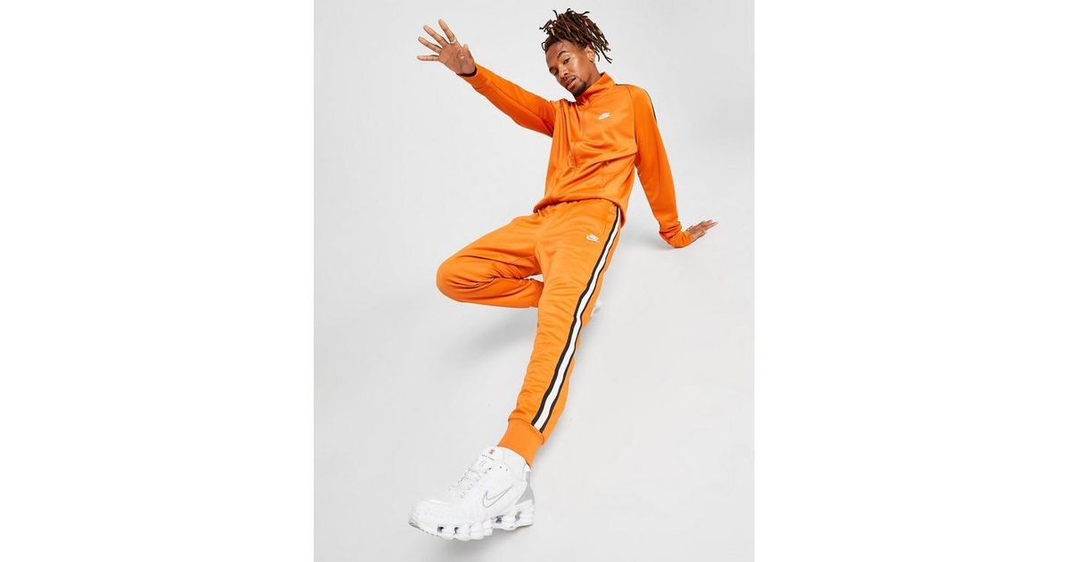 nike track pants yellow