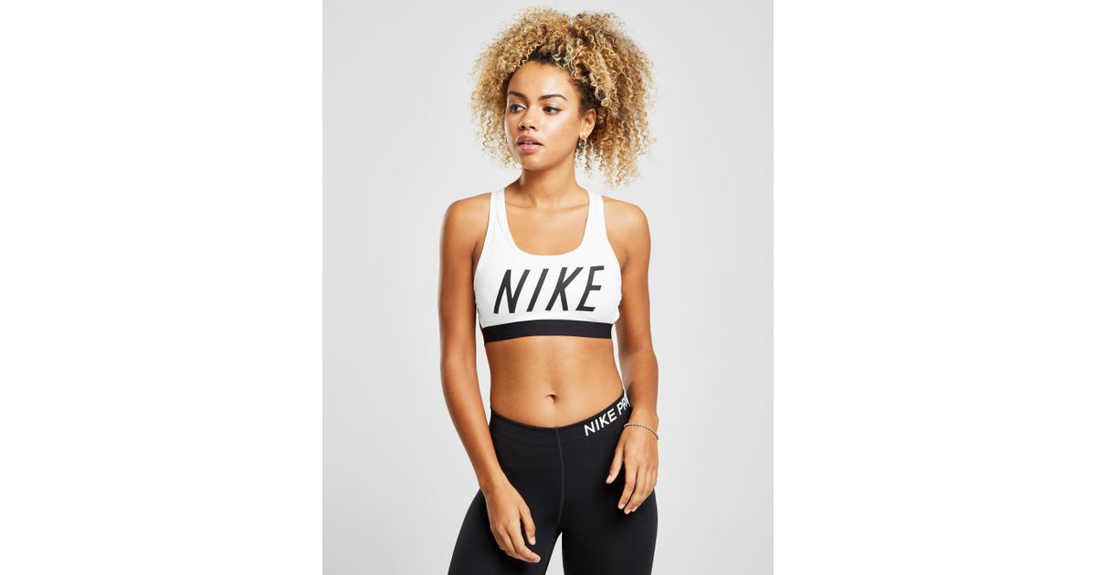 nike training mid support swoosh bra in white