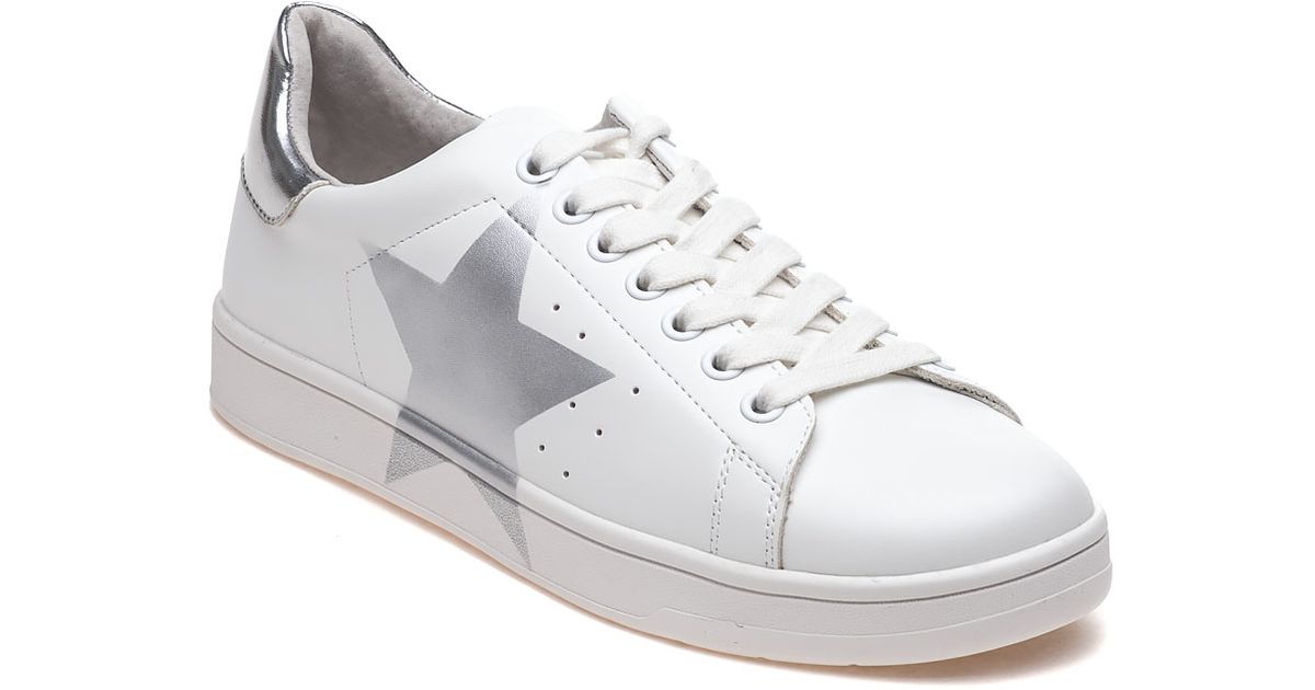 white sneakers with silver stars