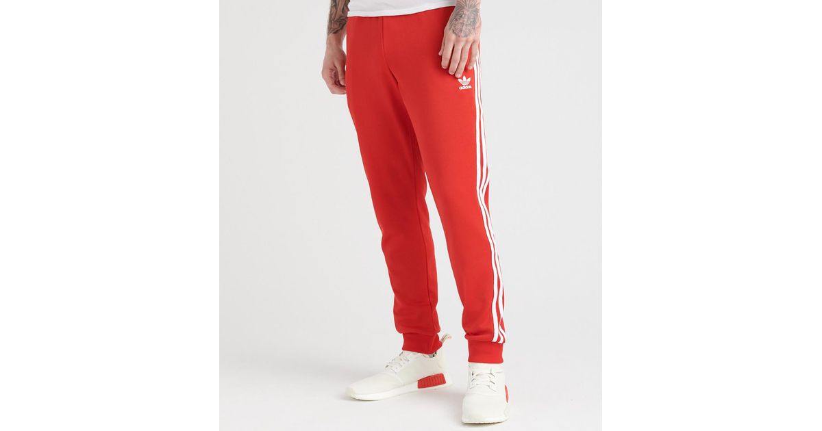 red sst track pants