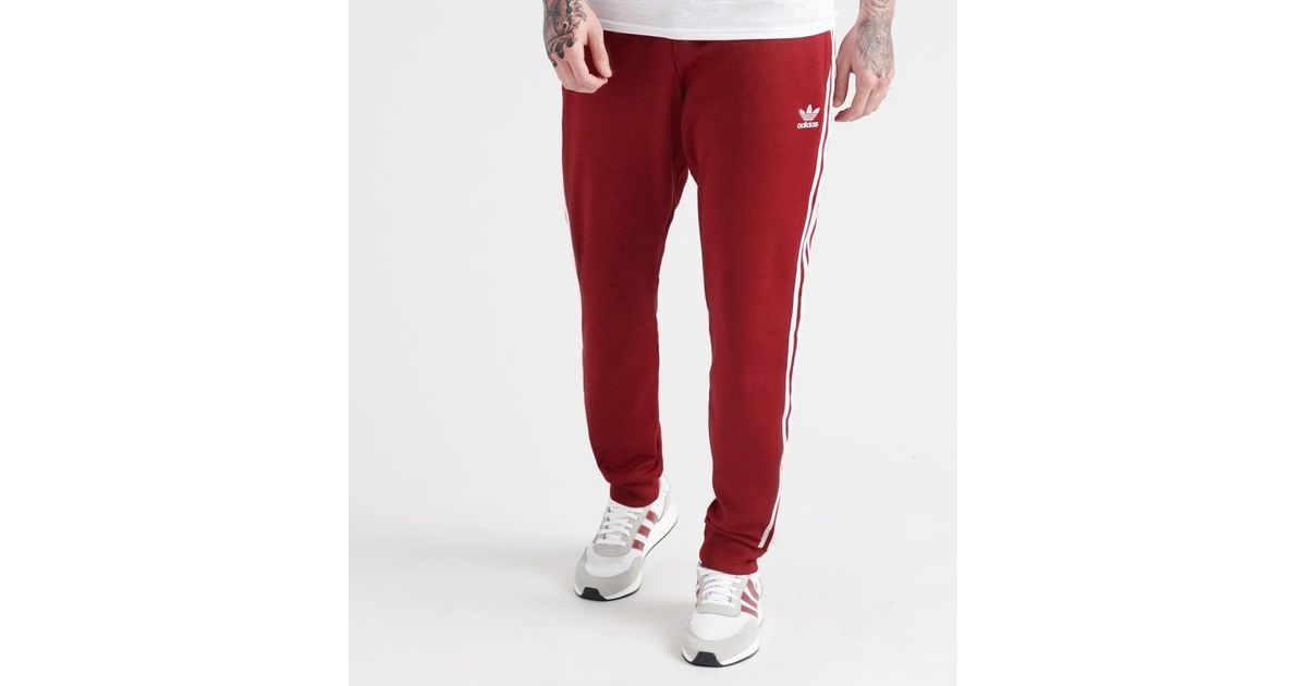 adidas burgundy track pants