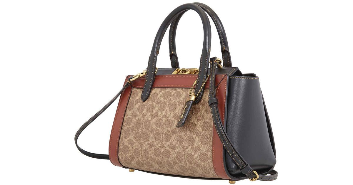 coach troupe carryall in signature canvas