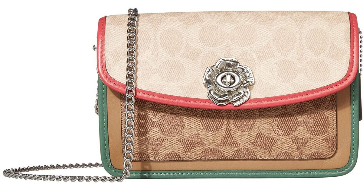 parker crossbody in signature canvas with blossom print