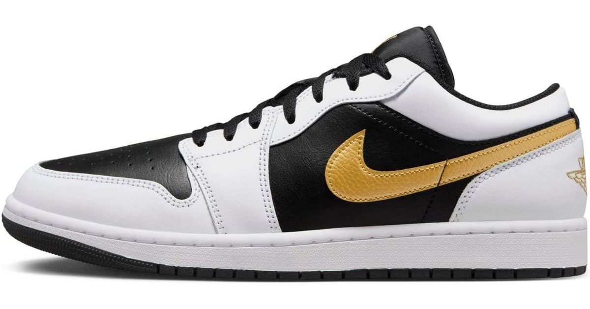 black and gold low top jordan 1