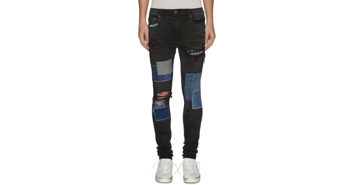 Amiri Denim Paint Splatter Print Mix Patch Ripped Jeans in Black for ...