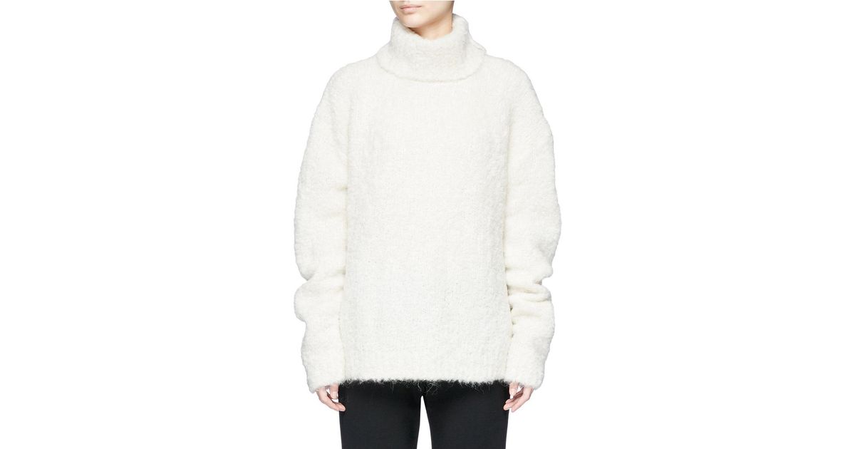 oversized white turtleneck sweater